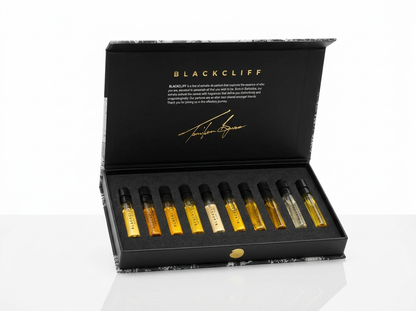 Open black box displaying 10 dropper vials with gold and clear liquid
